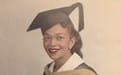 A picture of a young Judge Mary Lowe '54 in her graduation cap and gown