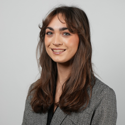photo of Ava Ascher_woman with long hair and light suit jacket